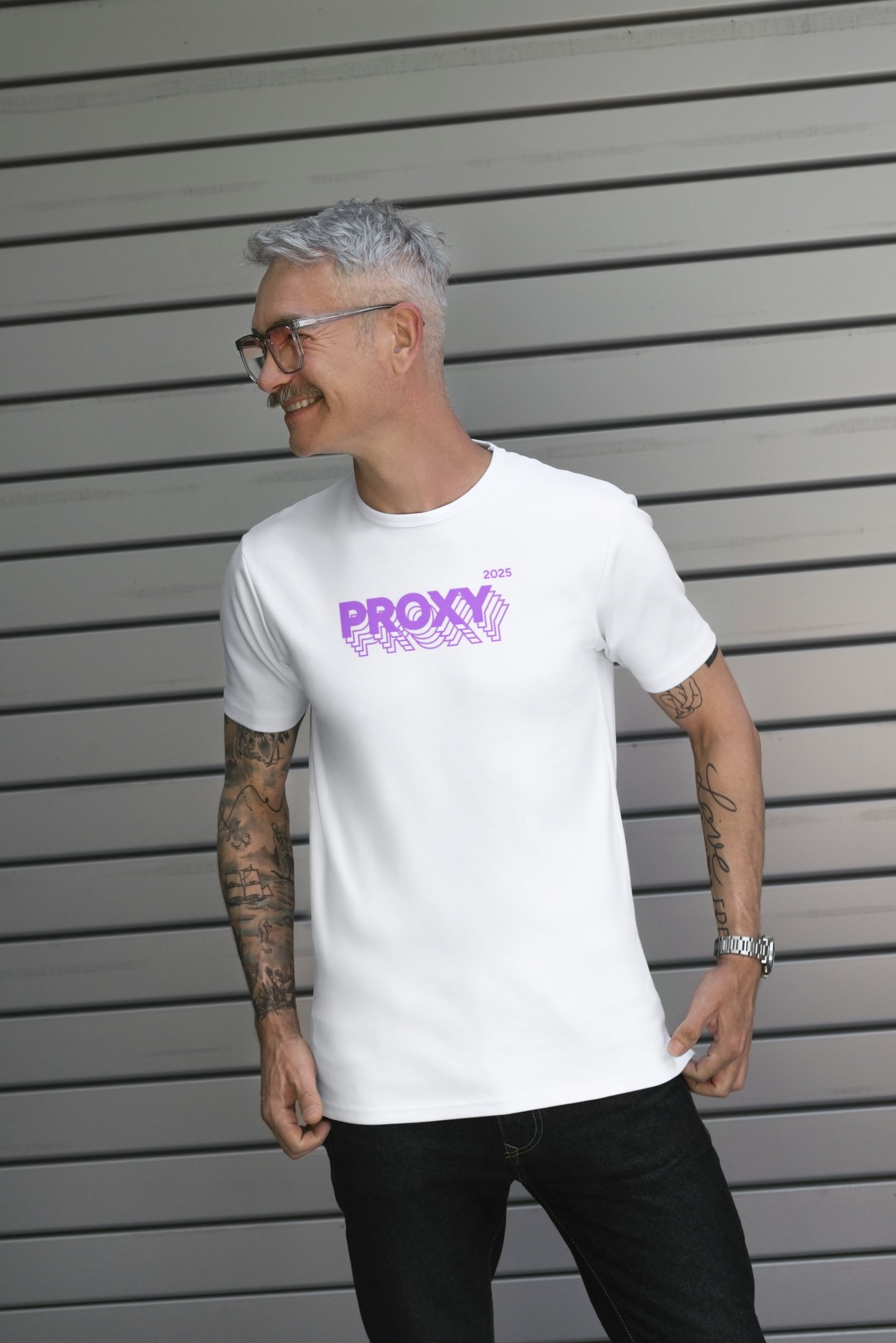 Man in the white Proxy shirt with the purple front logo